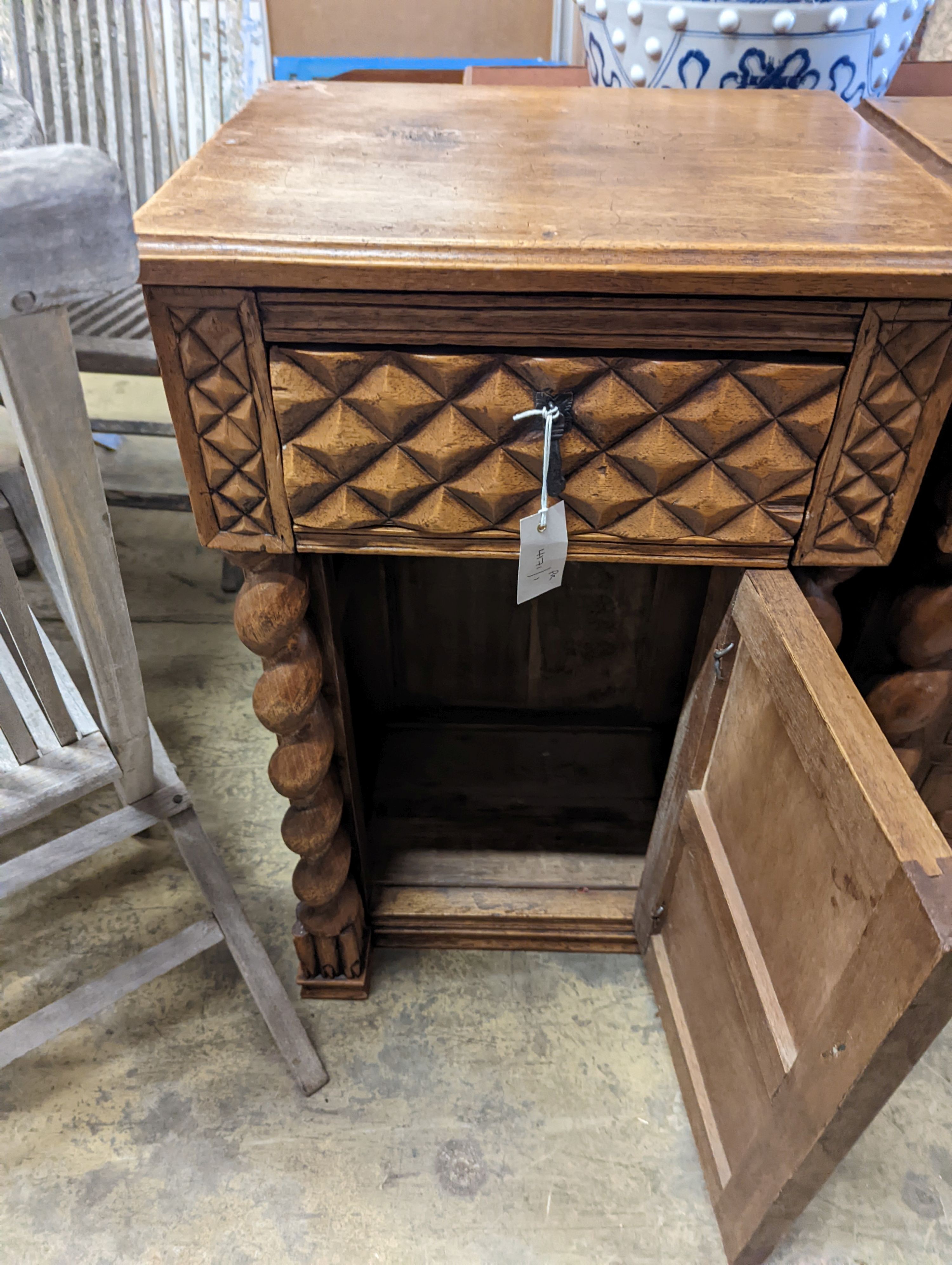 A pair of Spanish style carved walnut bedside cabinets, width 48cm, depth 38cm, height 79cm